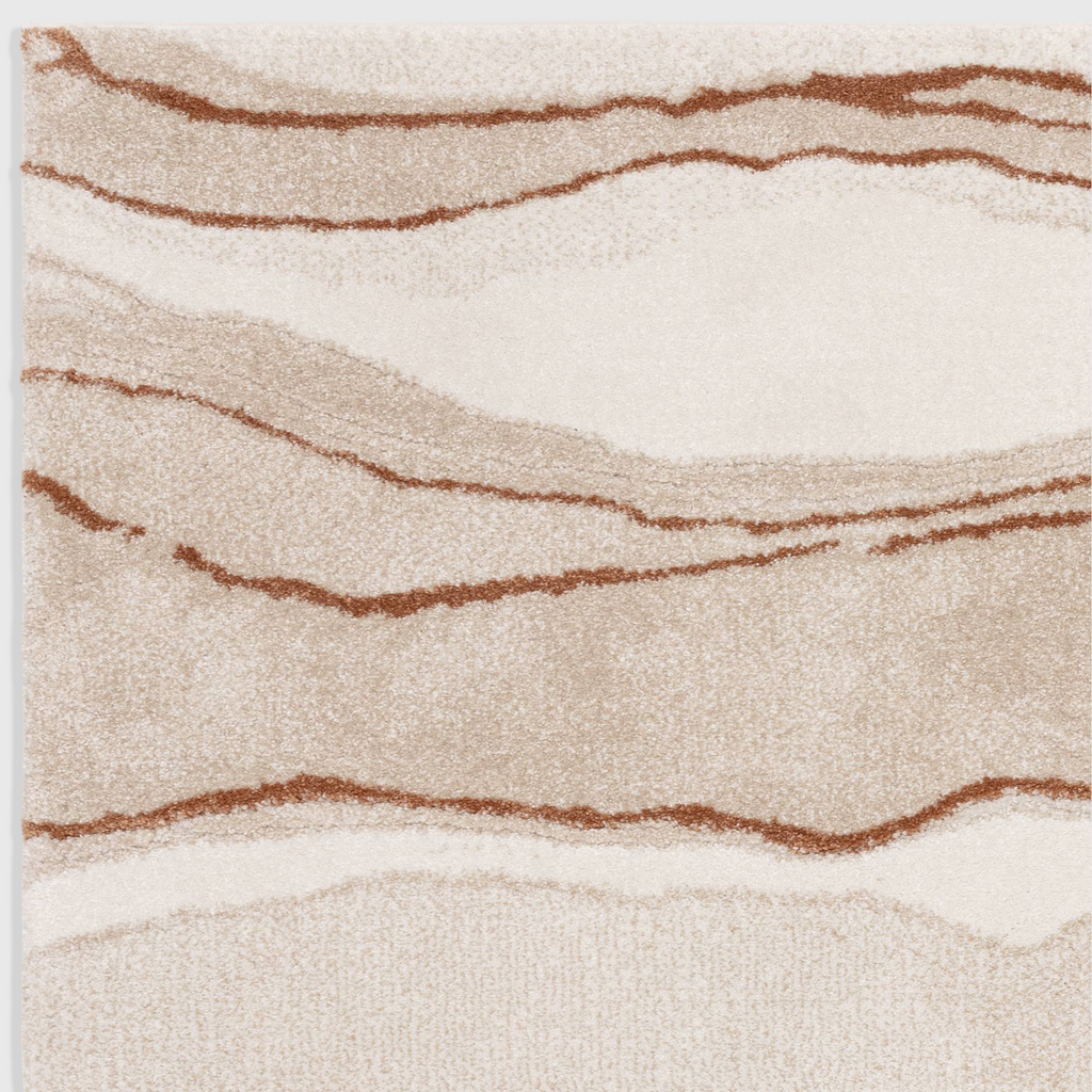 Alvo Rugs Miraga Quartz Terra rug with shaggy high-low pile, featuring abstract orange and cream wavy patterns.