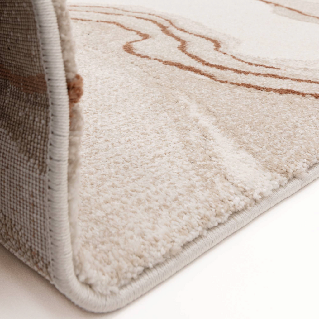 Alvo Rugs Miraga Quartz Terra rug corner view showing cream and orange shaggy high-low pile texture