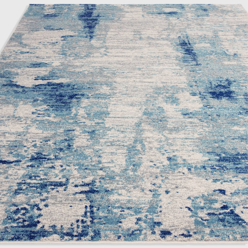 Alvo Rugs Novella Mirage Nv36 abstract area rug featuring vibrant blue and grey tones in a durable polypropylene pile.
