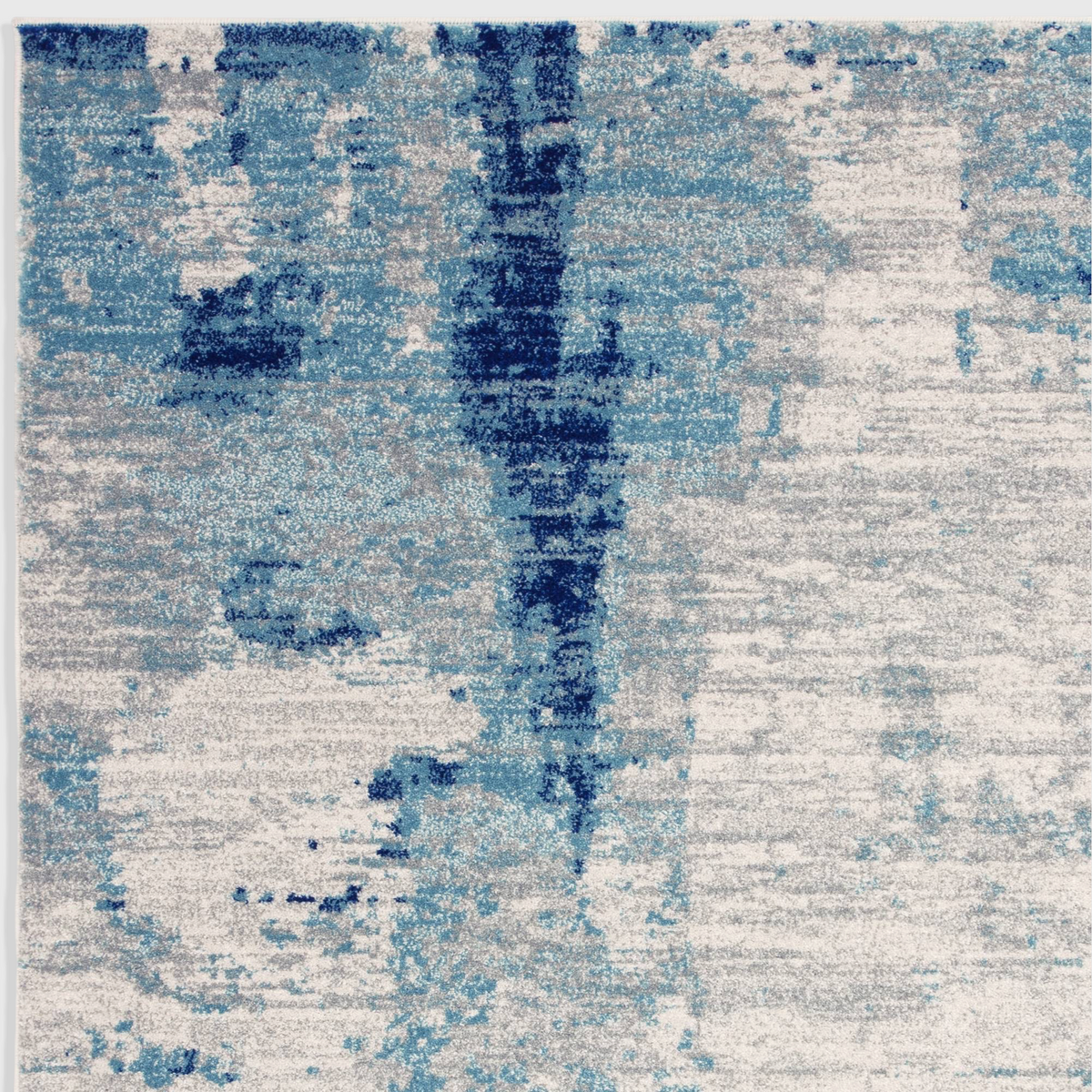 Alvo Rugs Novella Mirage Nv36 abstract area rug featuring saturated blue and grey tones in a soft polypropylene pile.