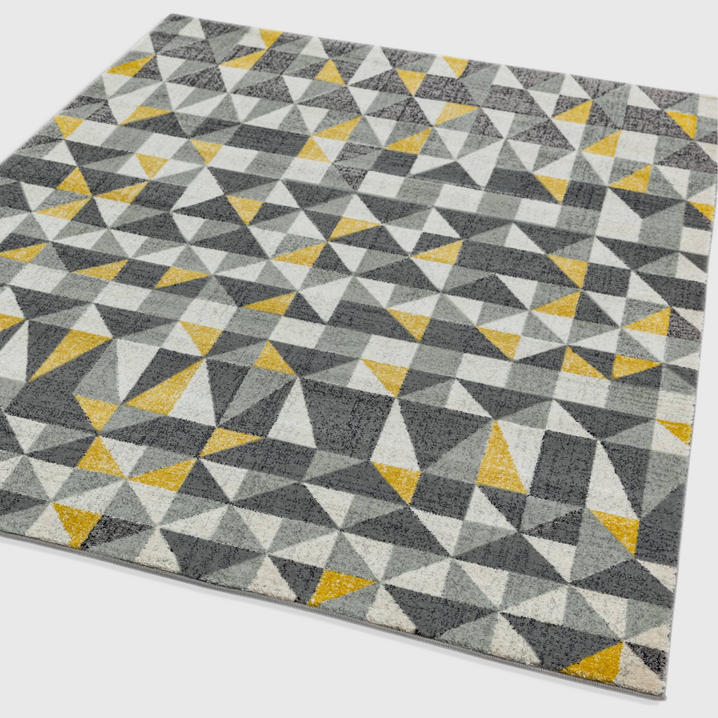 Alvo Rugs Novella Nv01 geometric flag rug in grey and yellow with a modern pixelated triangle pattern