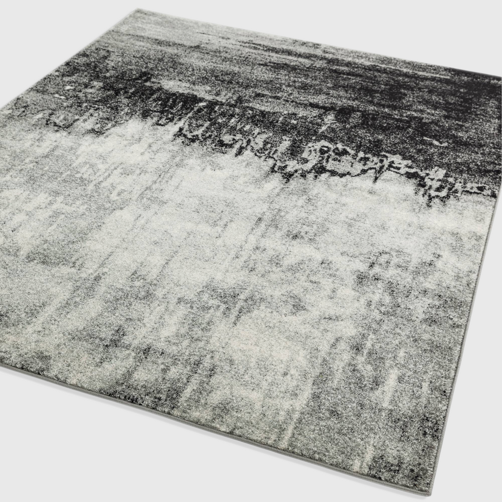 Alvo Rugs Novella Nv03 abstract area rug in distressed grey and silver tones with a soft polypropylene pile.