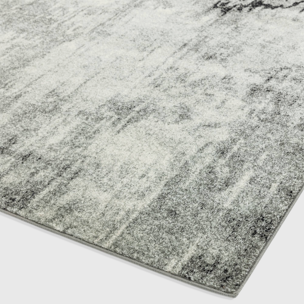 Alvo Rugs Novella Nv03 grey and silver abstract distressed polypropylene rug with a soft cut pile texture.