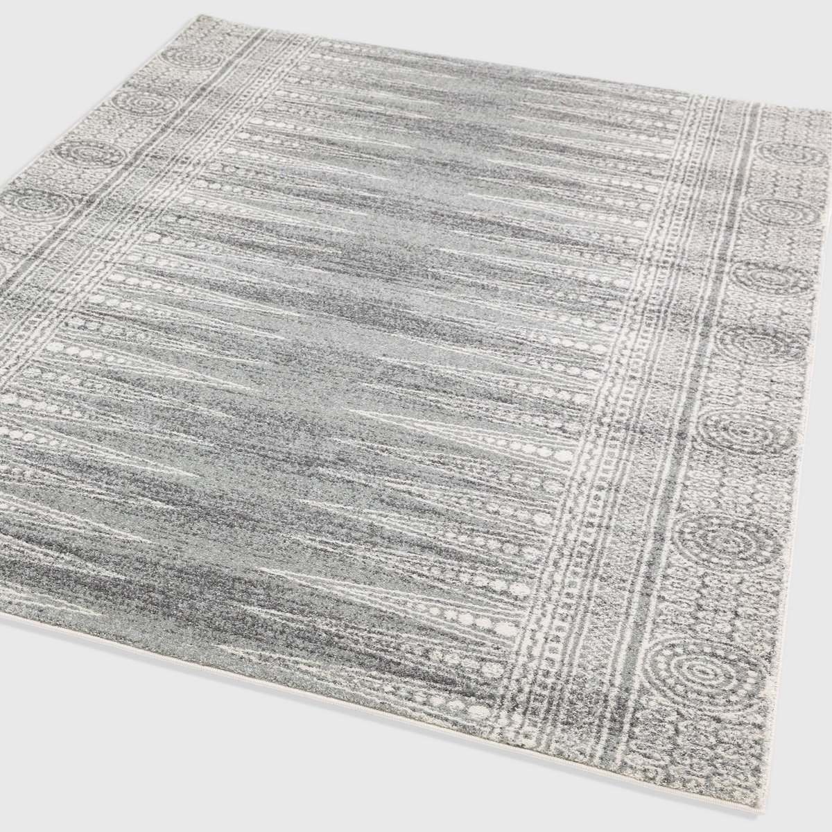 Alvo Rugs Novella Nv07 grey woven polypropylene rug with a classic patterned border and soft cut pile texture.