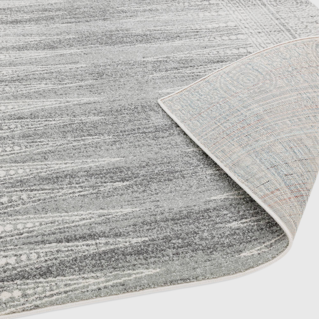 Alvo Rugs Novella Nv07 grey woven polypropylene rug showing the soft cut pile surface and durable jute backing