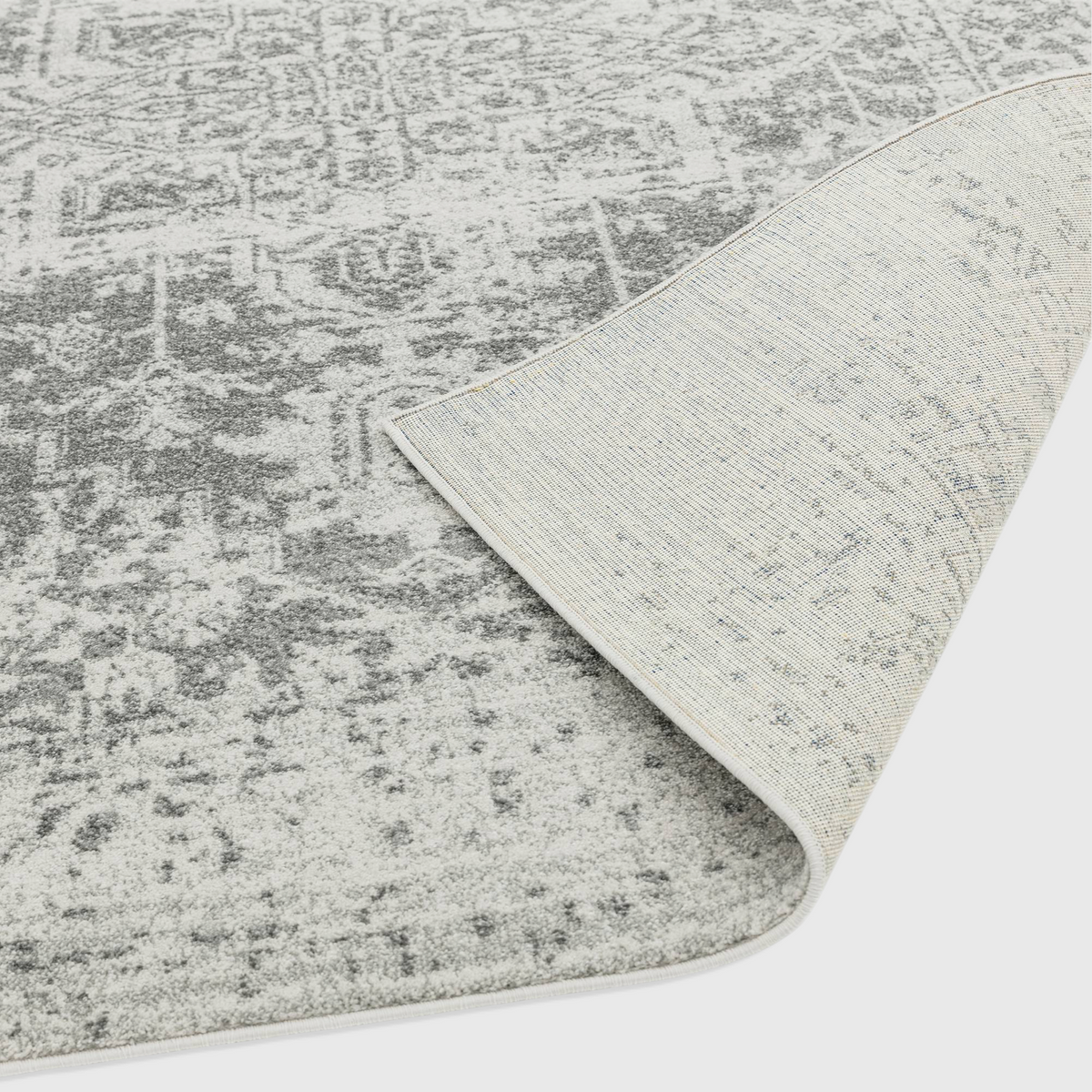 Alvo Rugs Novella antique grey polypropylene rug showing the soft cut pile texture and durable jute backing detail