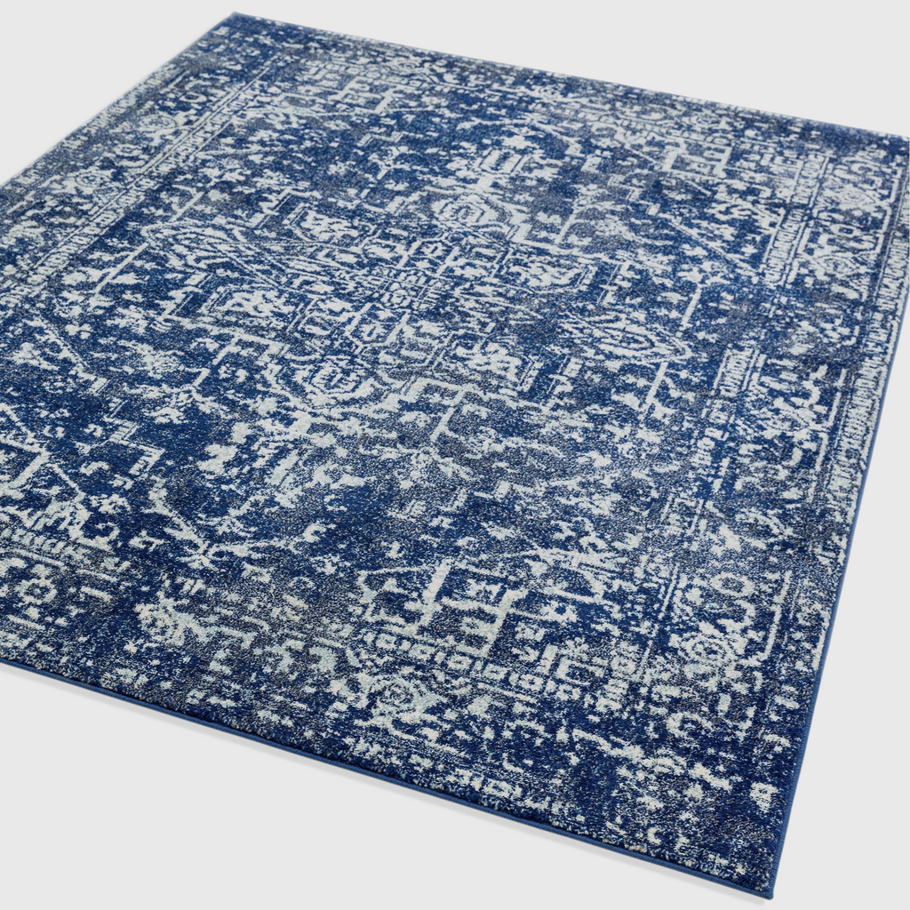 Alvo Rugs Novella Antique Navy Nv11 area rug featuring a classic distressed blue and white pattern in polypropylene.