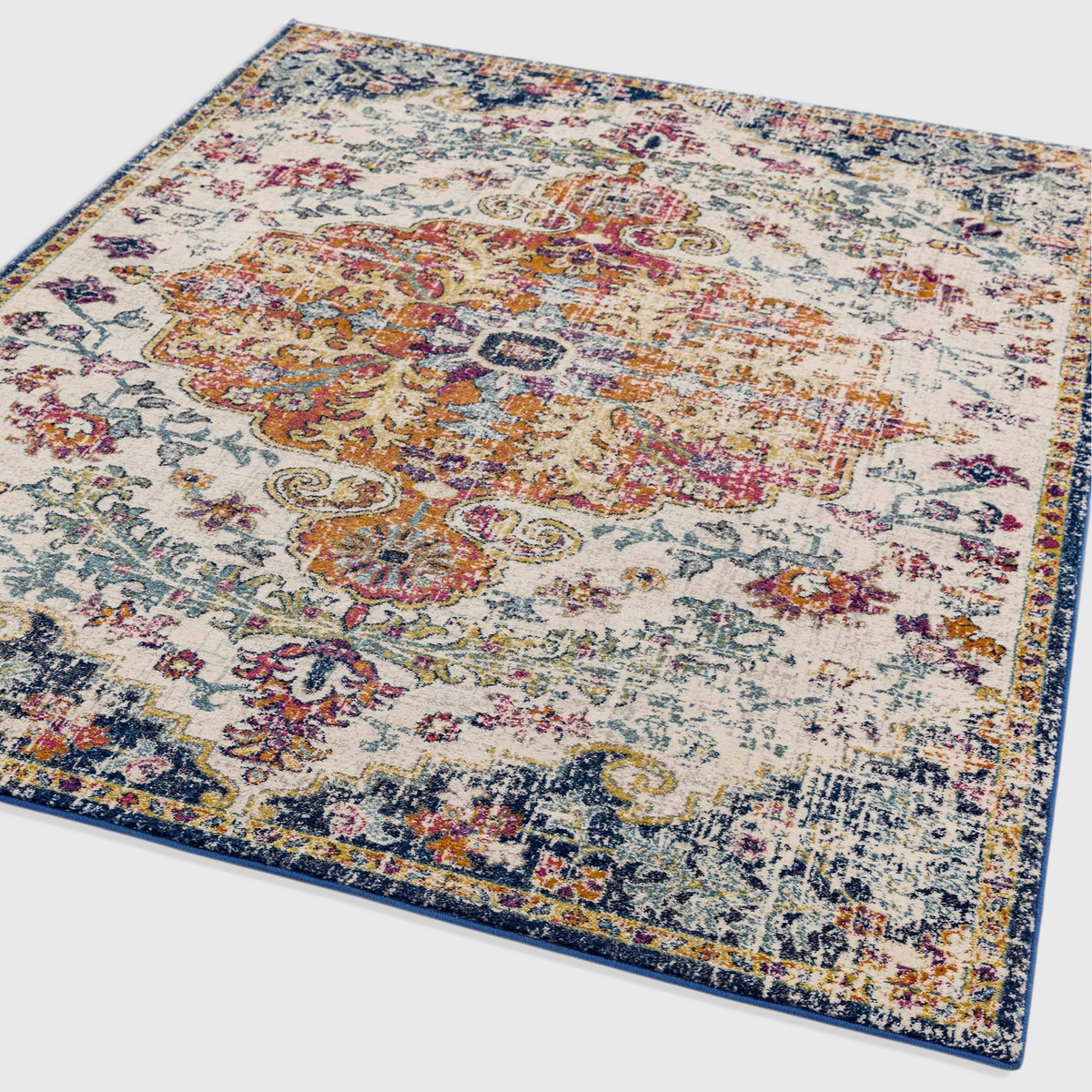 Alvo Rugs Novella Nv12 medallion area rug featuring a vibrant multi-coloured distressed pattern on a cream base.