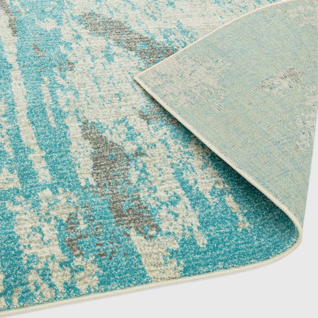 Alvo Rugs Novella Nv15 abstract painterly rug in duck egg blue with a durable polypropylene pile and jute backing.