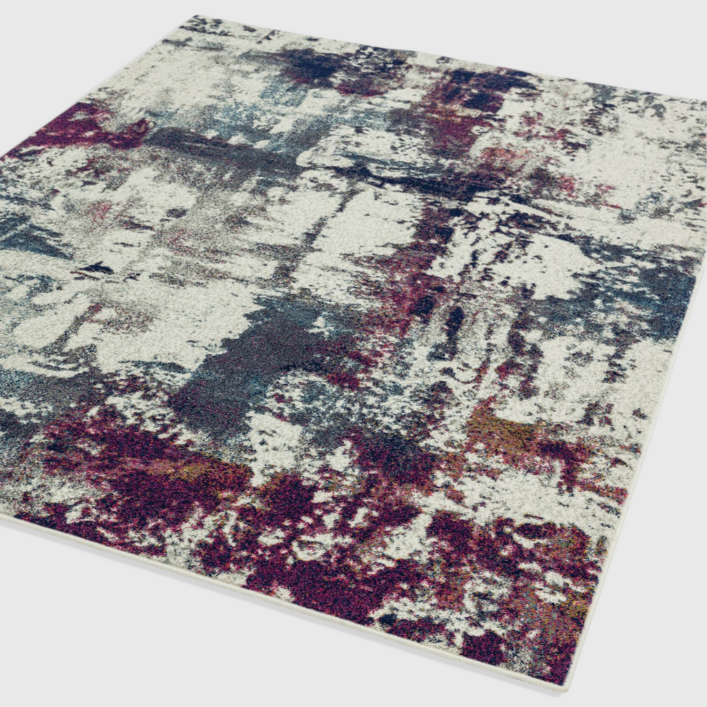 Alvo Rugs Novella Nv23 abstract area rug featuring a vibrant navy and multi-coloured pattern on a soft polypropylene pile