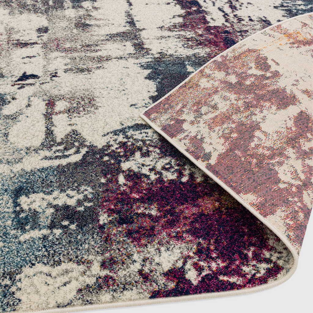 Alvo Rugs Novella Nv23 abstract navy and multi-coloured polypropylene rug with a folded corner showing jute backing