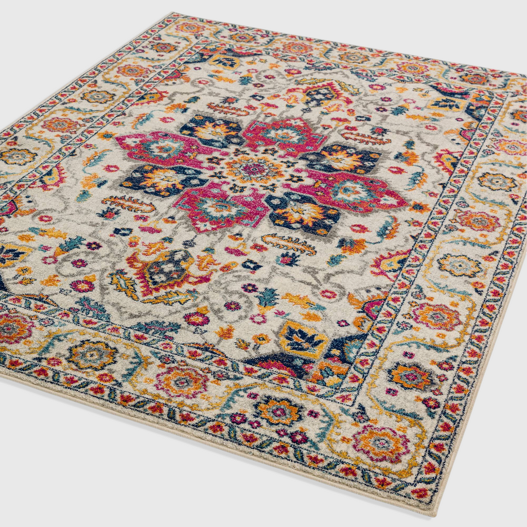 Alvo Rugs Novella Nv24 Persian style area rug featuring a cream white base with vibrant pink, blue, and yellow patterns