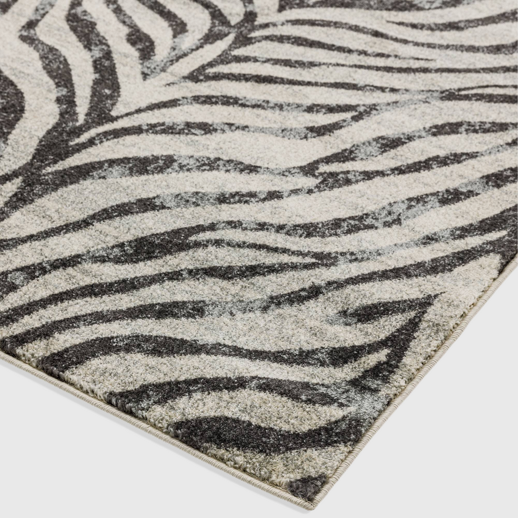 Alvo Rugs Novella Nv27 zebra print area rug in grey and silver tones with a soft, durable polypropylene cut pile.