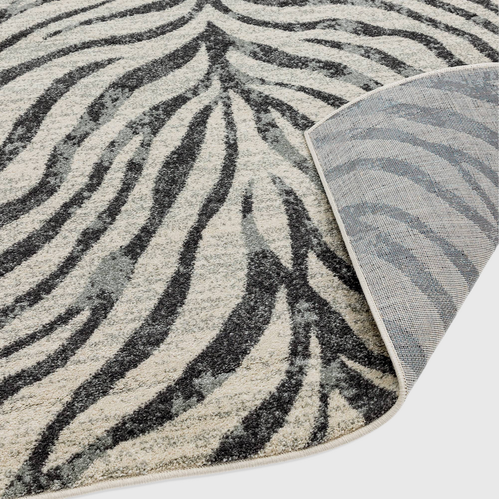 Alvo Rugs Novella Nv27 zebra print rug in grey and silver with a durable polypropylene pile and jute backing