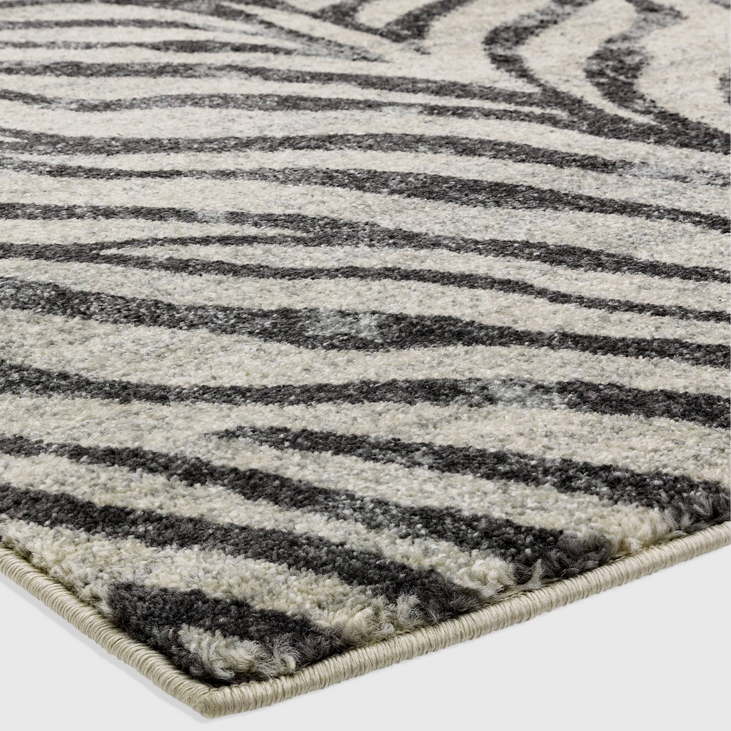 Alvo Rugs Novella Nv27 zebra print area rug in grey and silver tones with a soft, durable polypropylene cut pile.