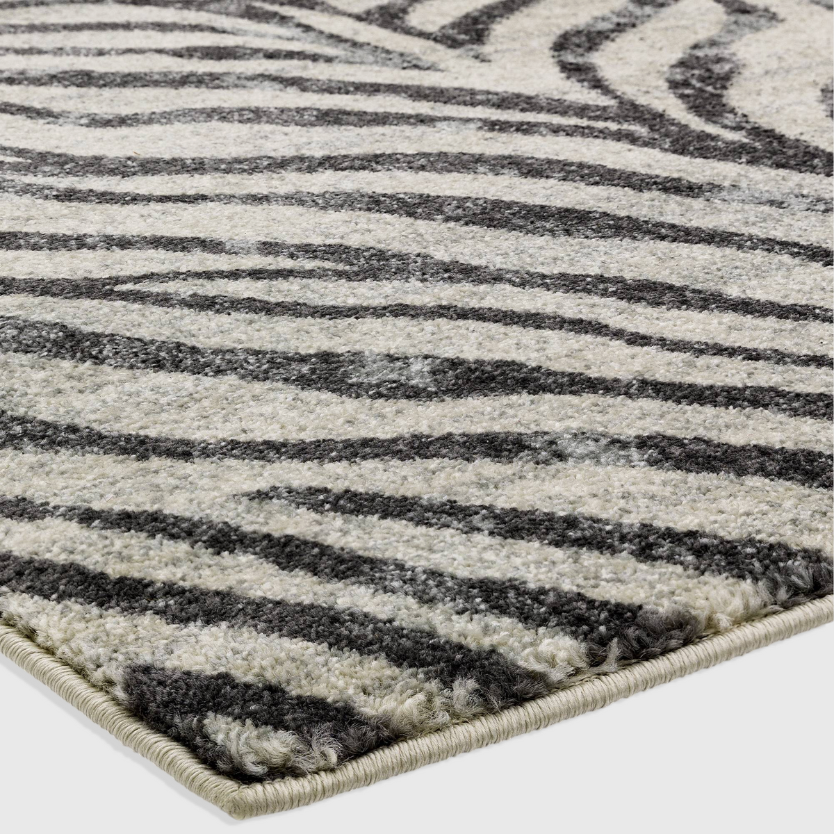 Alvo Rugs Novella Nv27 zebra print area rug in grey and silver tones with a soft, durable polypropylene cut pile.