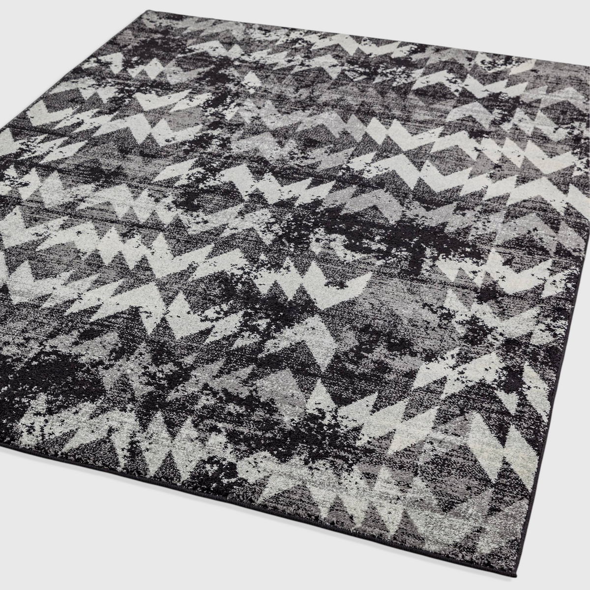 Alvo Rugs Novella Nv28 black and grey chevron patterned area rug with a modern distressed design and soft pile.