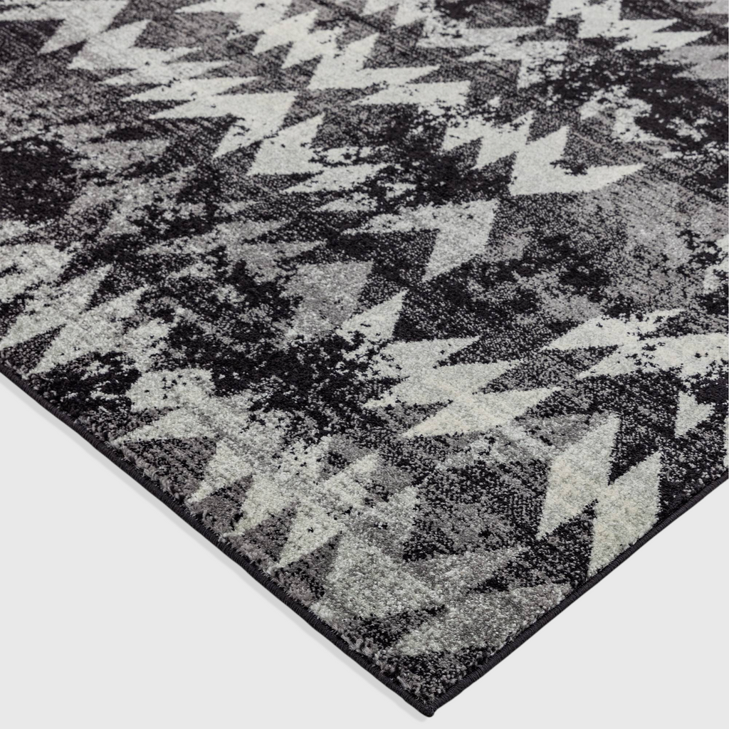 Alvo Rugs Novella Nv28 black and grey chevron patterned polypropylene rug with a soft cut pile texture