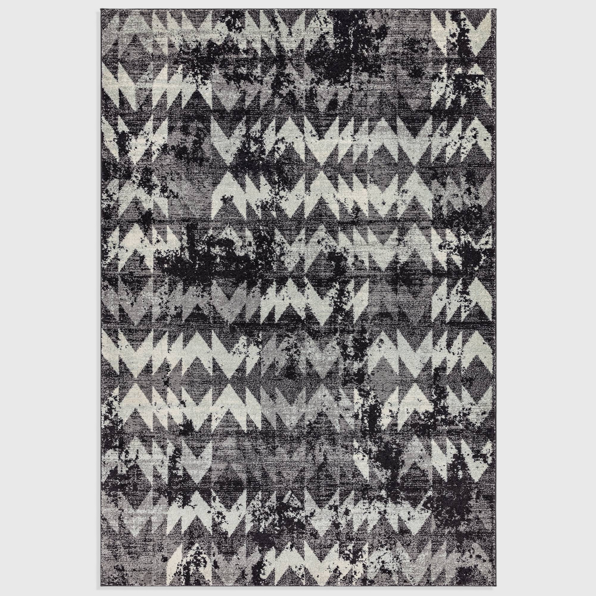 Alvo Rugs Novella Nv28 black and grey chevron patterned polypropylene rug with a modern distressed design.