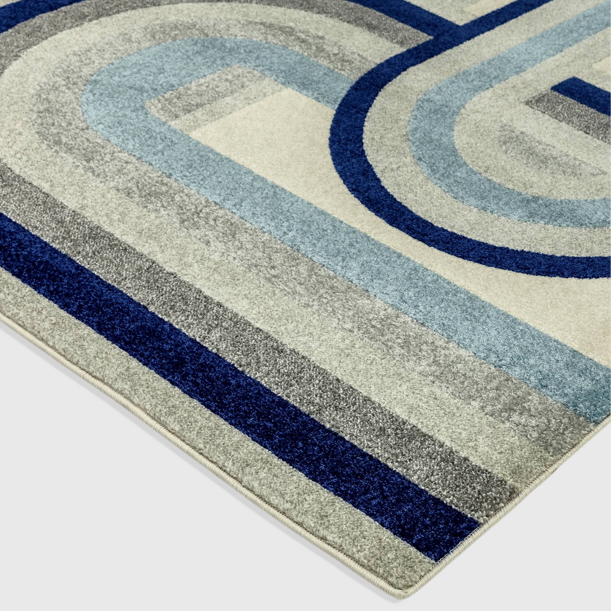 Alvo Rugs Novella Retro blue polypropylene rug with geometric curved lines and a soft cut pile texture