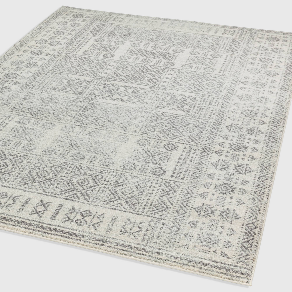 Alvo Rugs Novella Nv33 tribal grey rug with a Moroccan-inspired pattern in soft silver and grey tones.