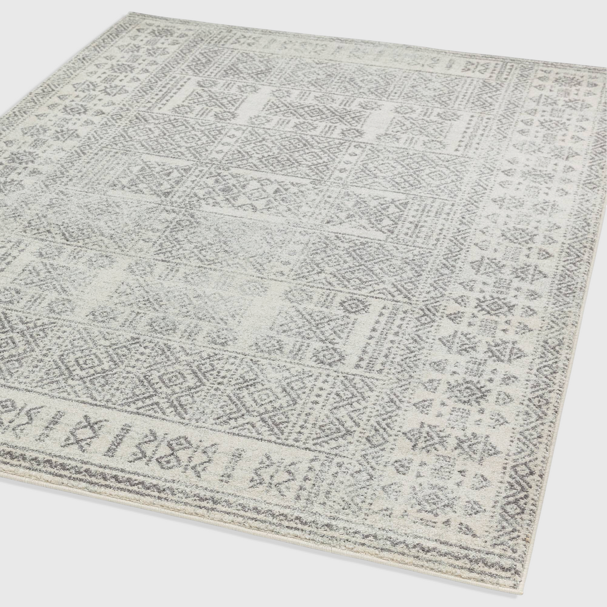 Alvo Rugs Novella Nv33 tribal grey rug with a Moroccan-inspired pattern in soft silver and grey tones.