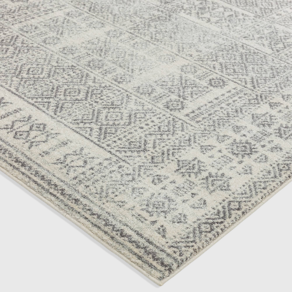 Alvo Rugs Novella Nv33 tribal grey rug featuring a soft polypropylene Moroccan pattern in silver and grey tones.