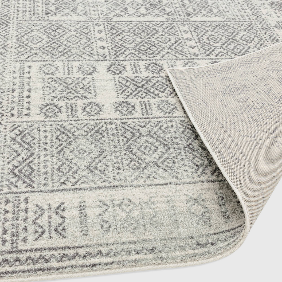 Alvo Rugs Novella Nv33 tribal grey rug with Moroccan pattern, showing durable polypropylene pile and jute backing.