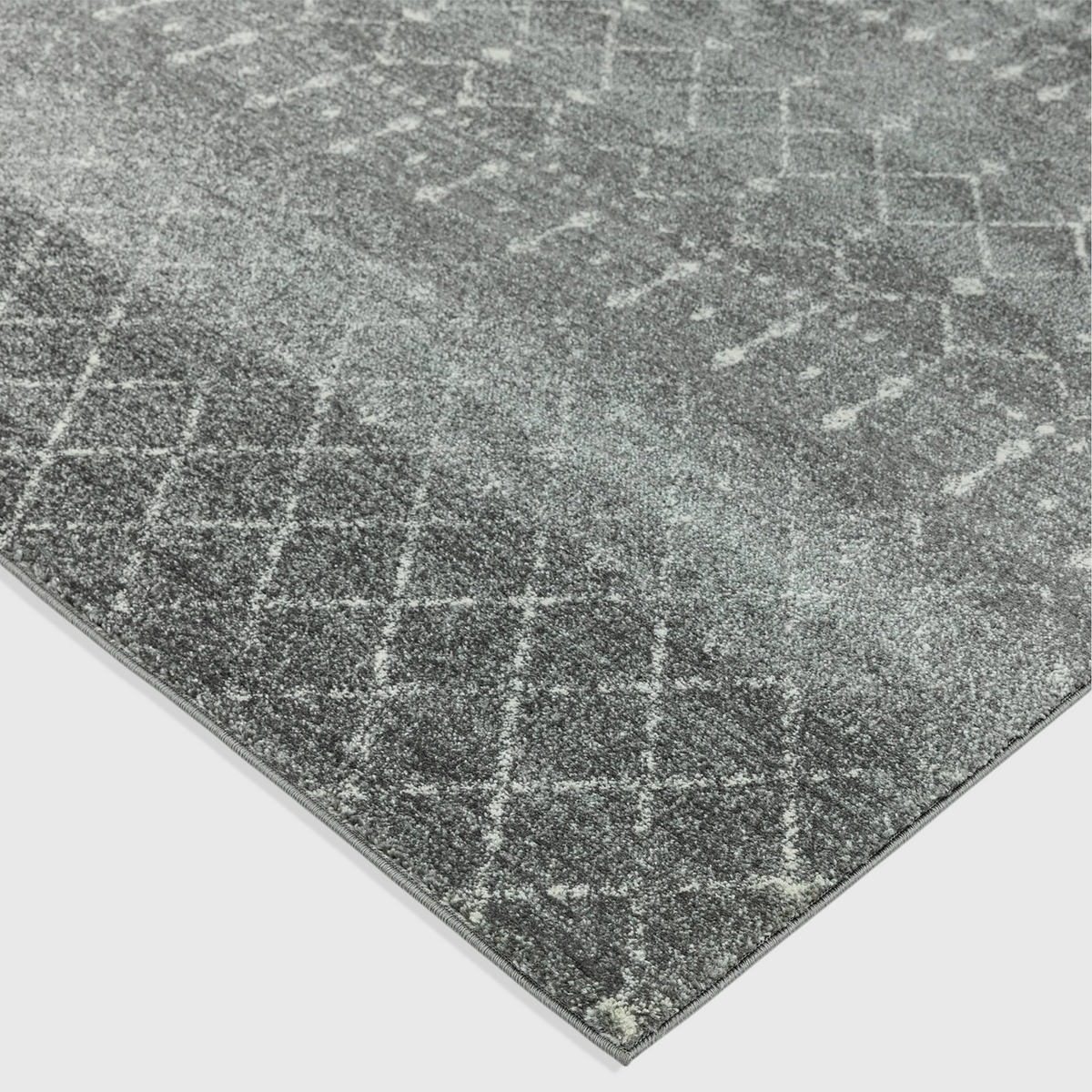 Alvo Rugs Novella dark grey Moroccan style area rug with a soft polypropylene cut pile and intricate geometric pattern.