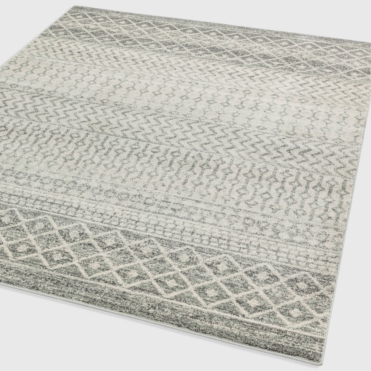 Alvo Rugs Novella Nv35 Aztec grey rug featuring a Moroccan-inspired geometric pattern in soft silver and grey tones.