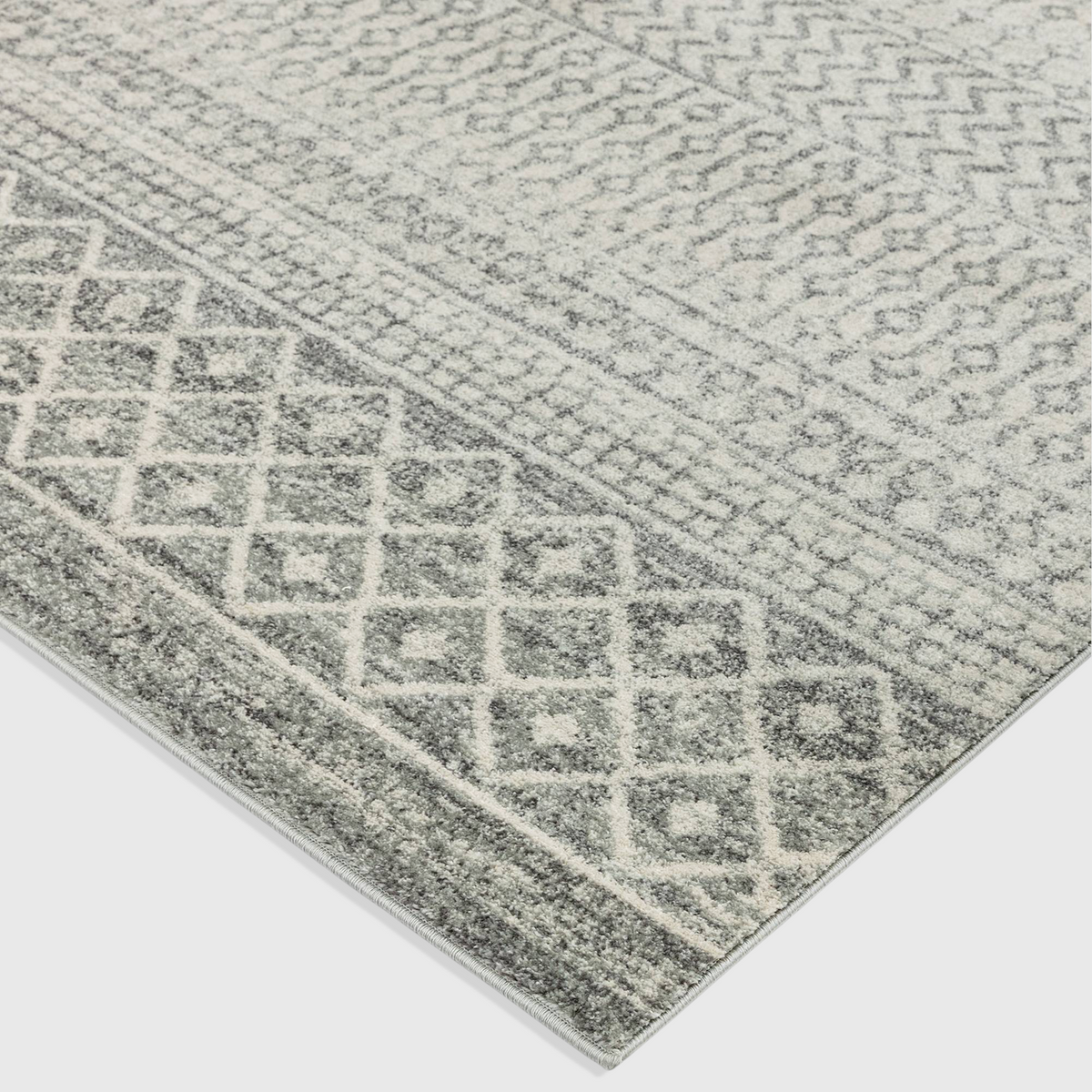 Alvo Rugs Novella Nv35 Aztec grey rug featuring a detailed Moroccan geometric pattern in soft silver and grey tones.