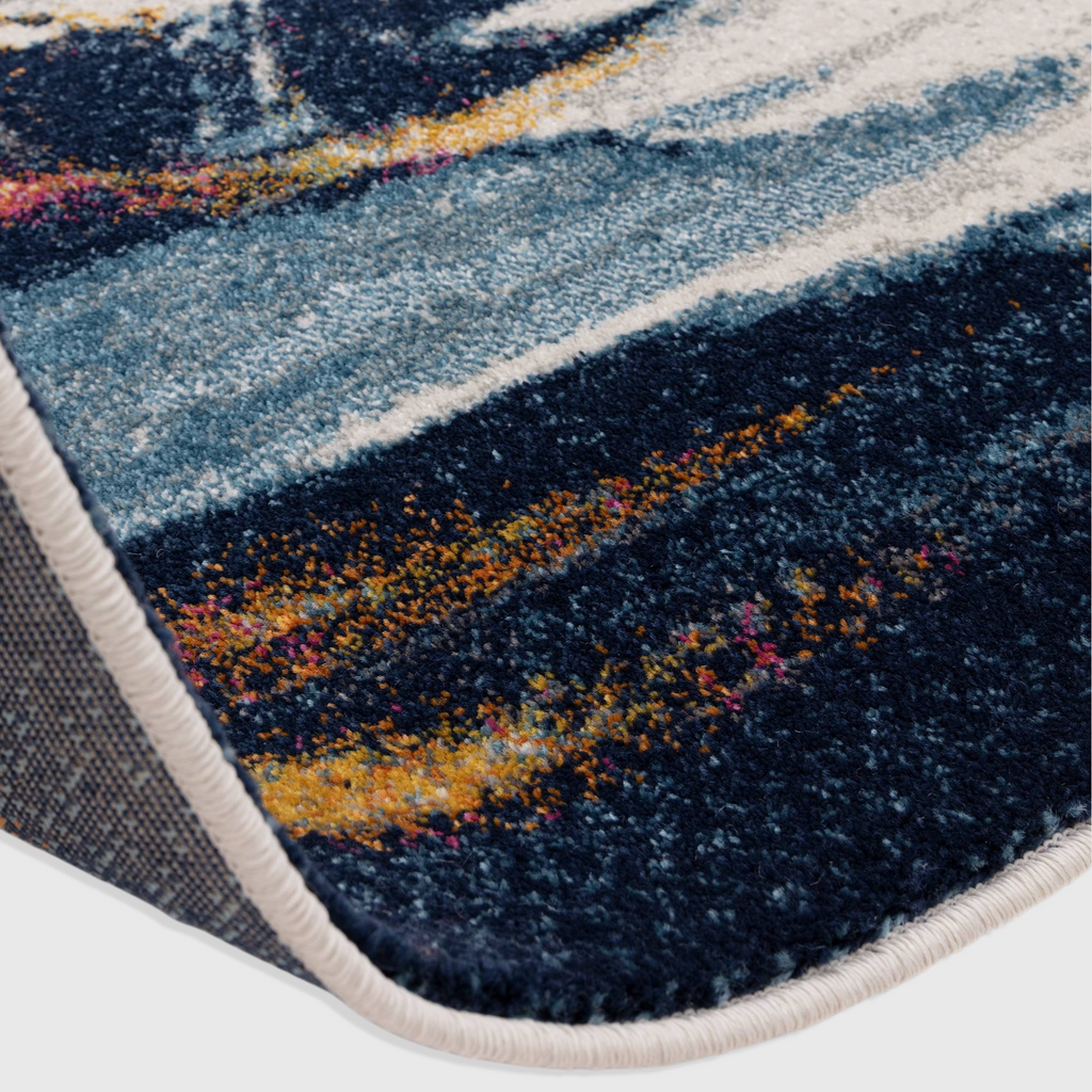 Alvo Rugs Novella Vista Nv42 abstract rug with blue, white, and orange tones in a soft polypropylene cut pile.