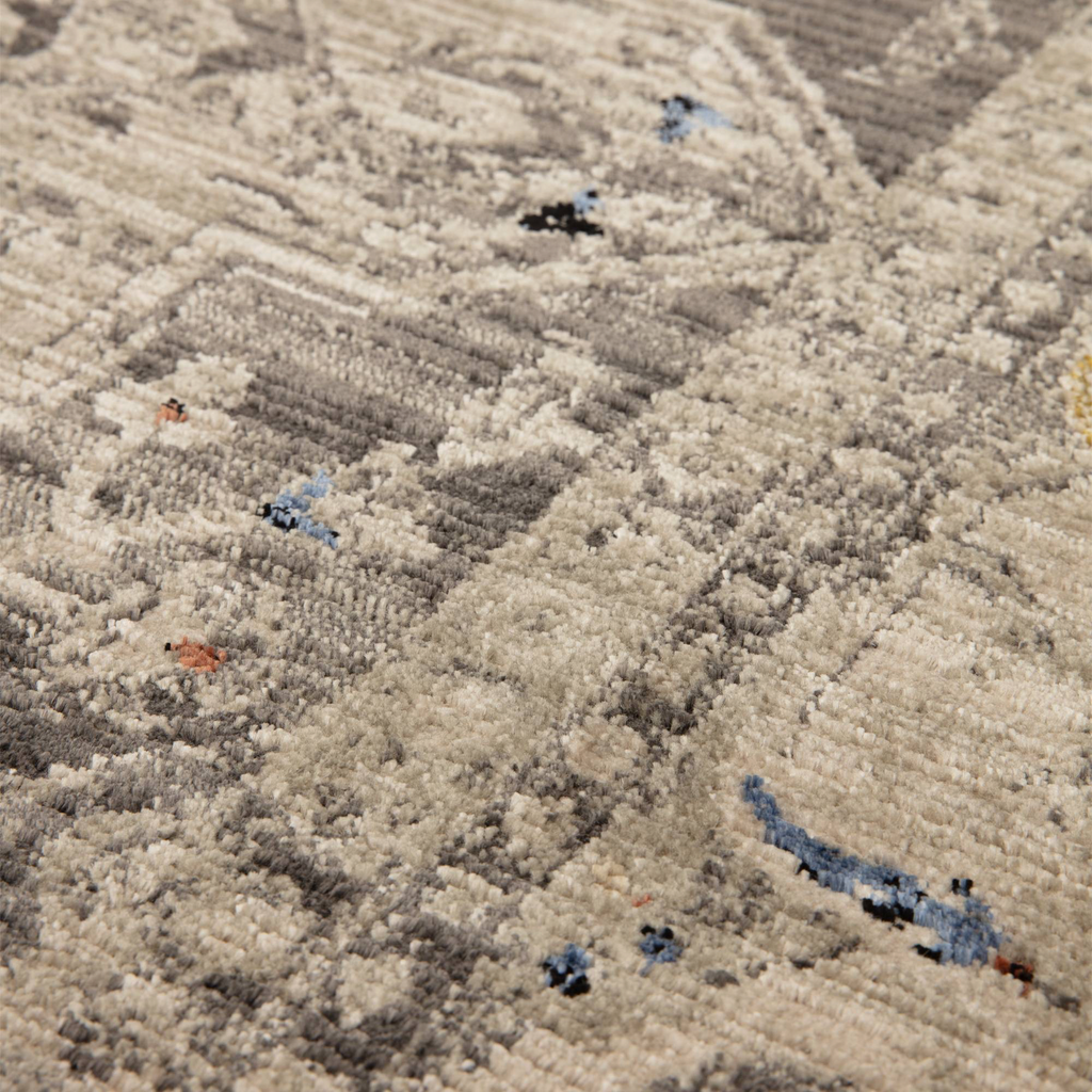Alvo Rugs Sovra charcoal medallion rug featuring a distressed grey and silver pattern with a soft polyester sheen.