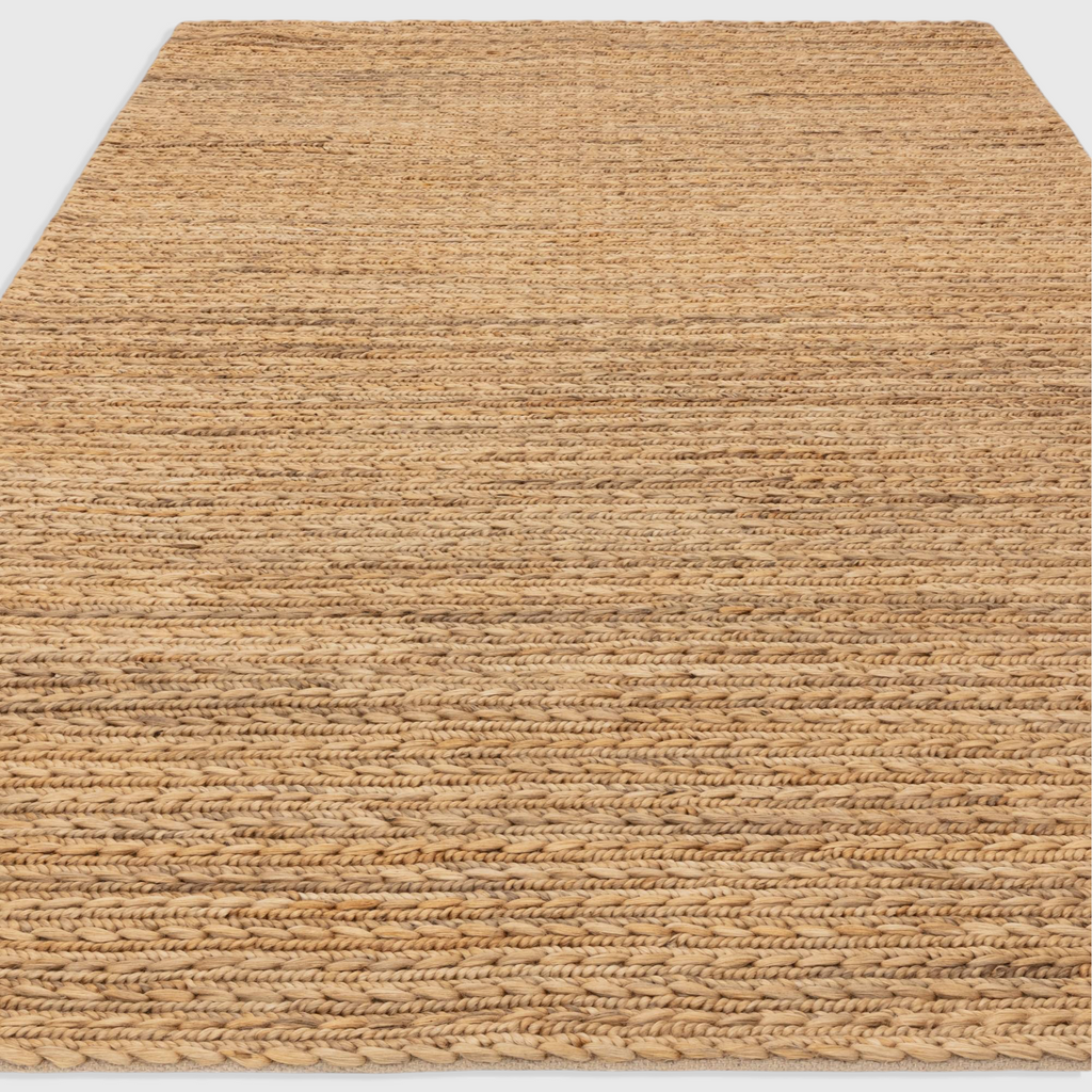 Alvo Rugs Oaks straw rug featuring a natural jute and cotton flatweave design with a textured braided finish.