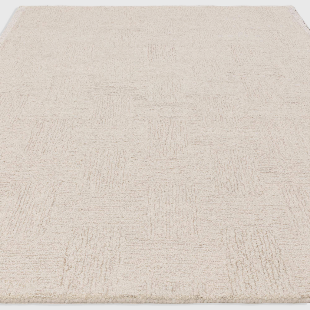 Alvo Rugs Theo Hatch white and sand wool rug with hand-tufted cross hatch pattern and loop pile texture.
