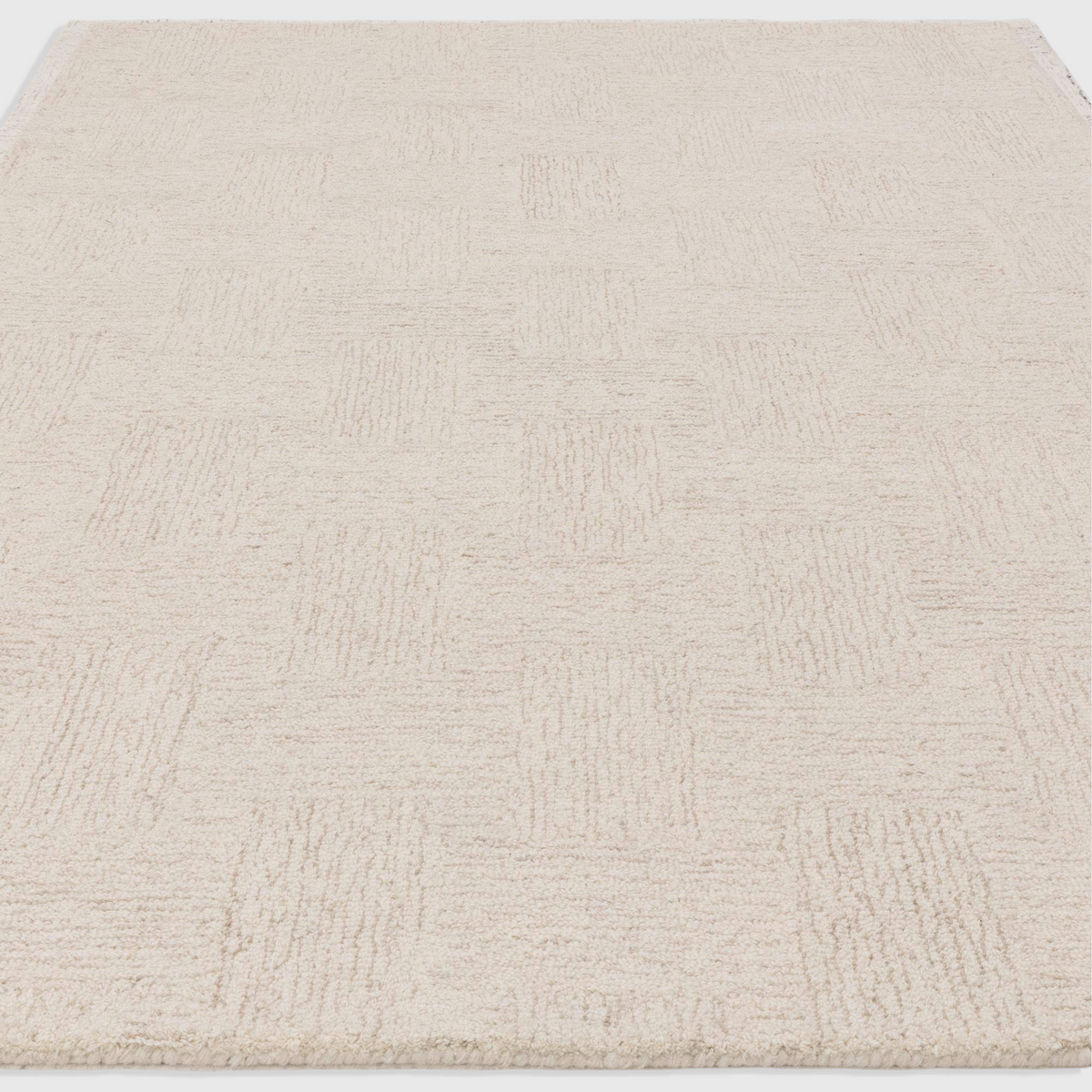 Alvo Rugs Theo Hatch white and sand wool rug with hand-tufted cross hatch pattern and loop pile texture.