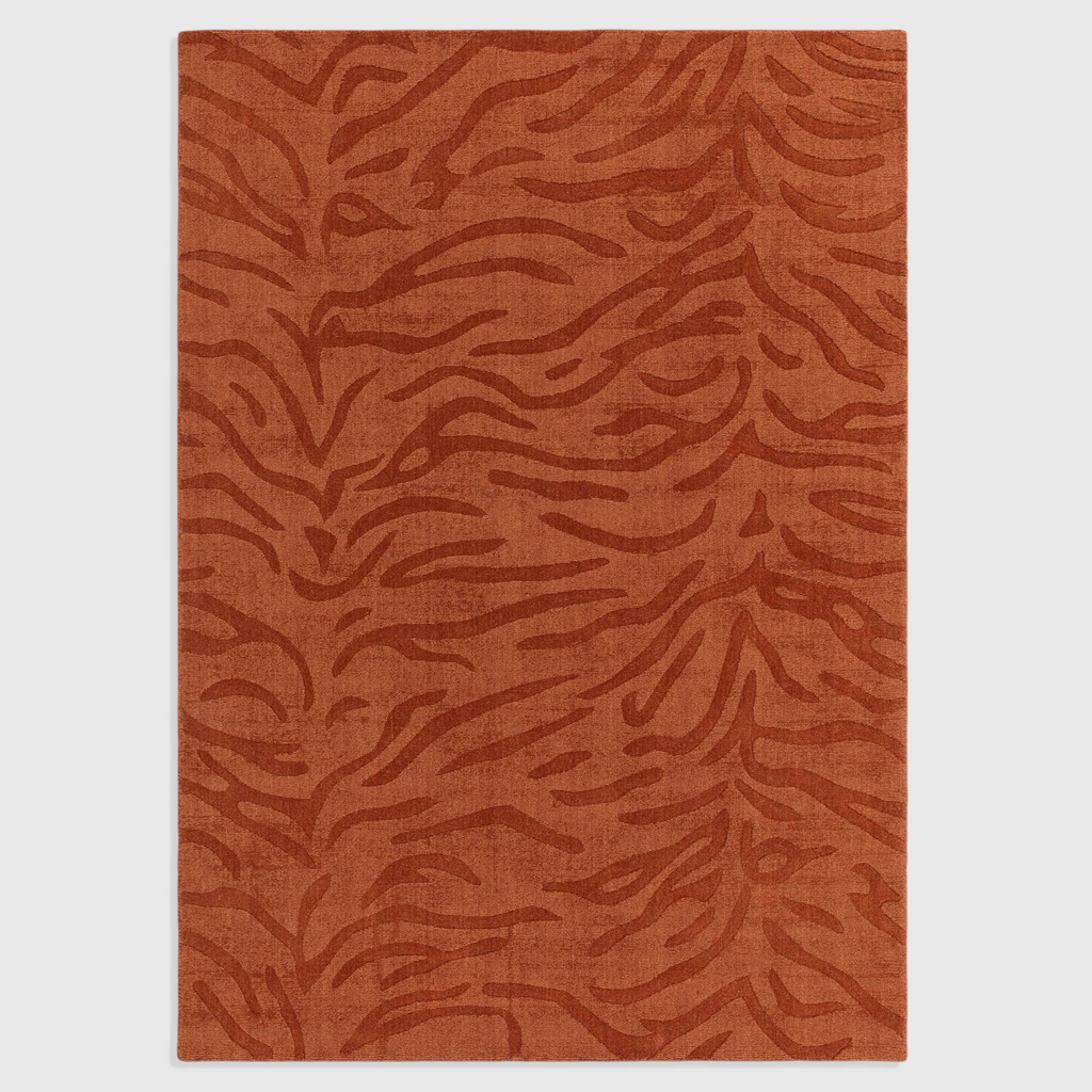 Alvo Rugs Tigris Spice wool rug featuring a textured orange tiger stripe pattern with cut and loop pile details.