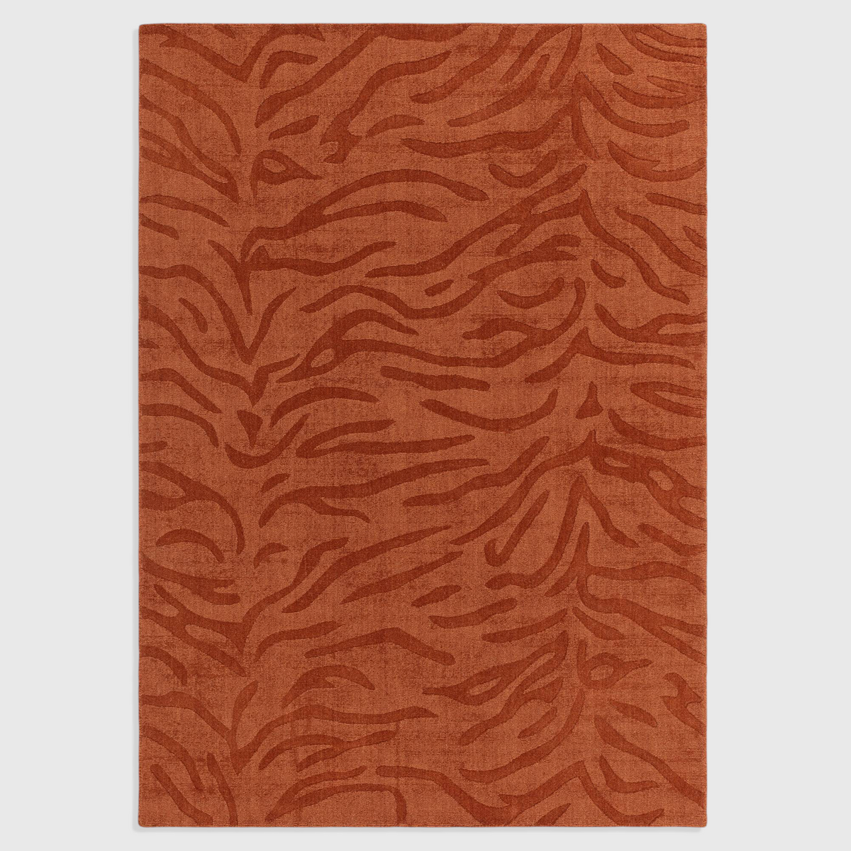Alvo Rugs Tigris Spice wool rug featuring a textured orange tiger stripe pattern with cut and loop pile details.