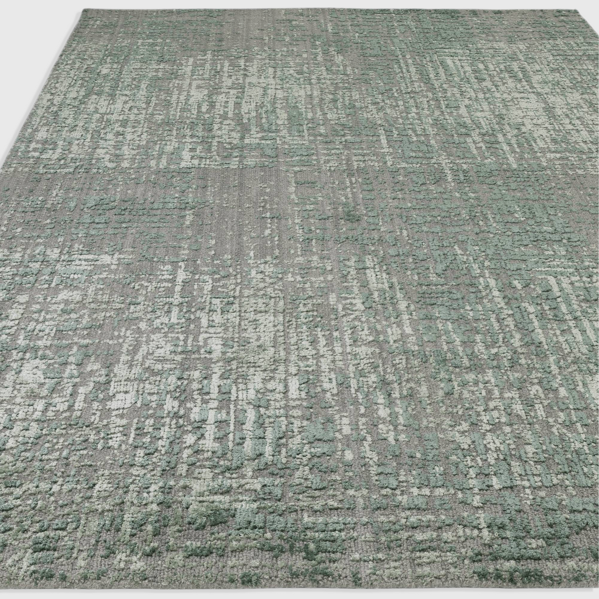 Alvo Rugs Torina forest green abstract area rug with a textured high-low wool and viscose cut and loop pile finish.
