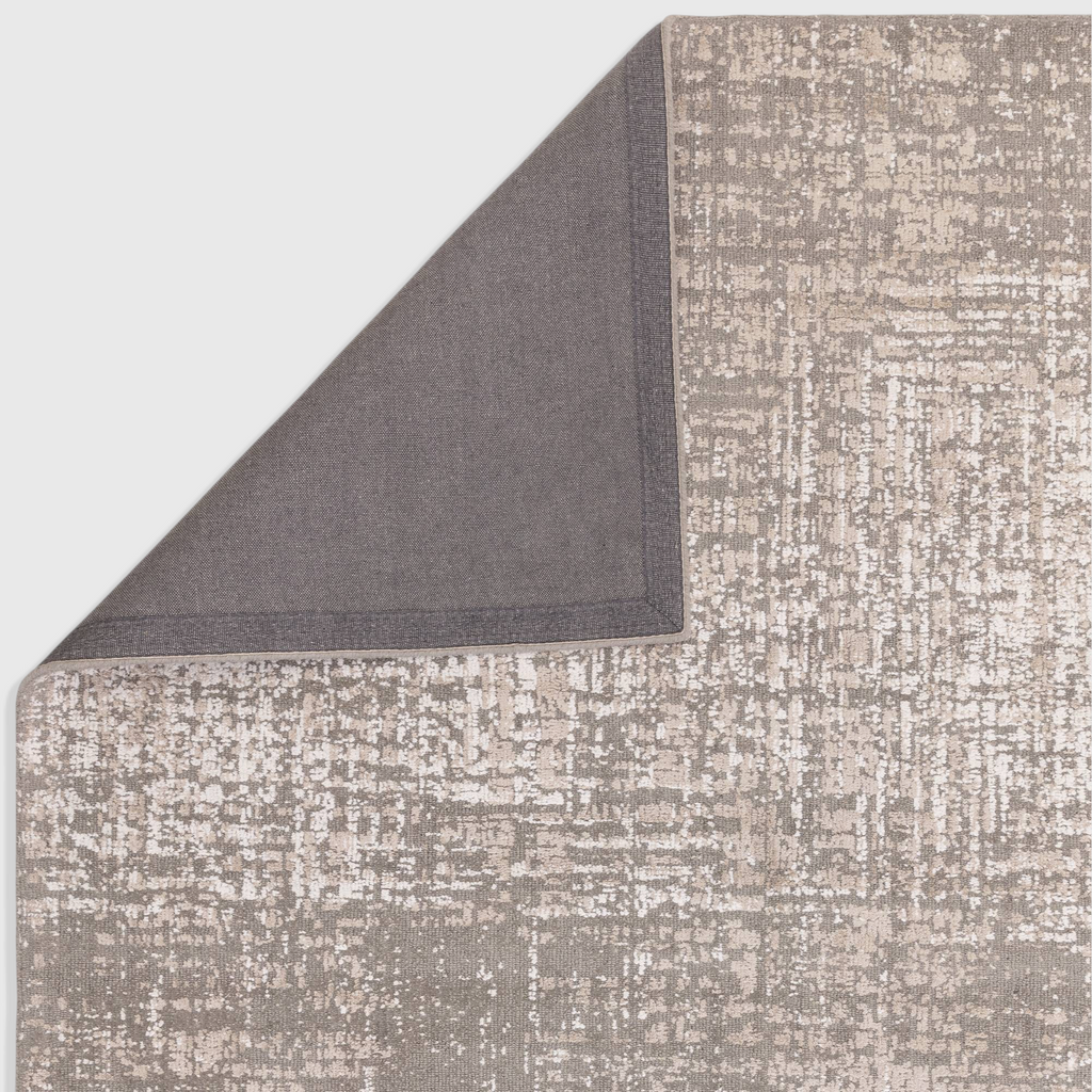 Alvo Rugs Torina natural beige abstract rug showing the textured cut and loop pile surface and dark grey backing.
