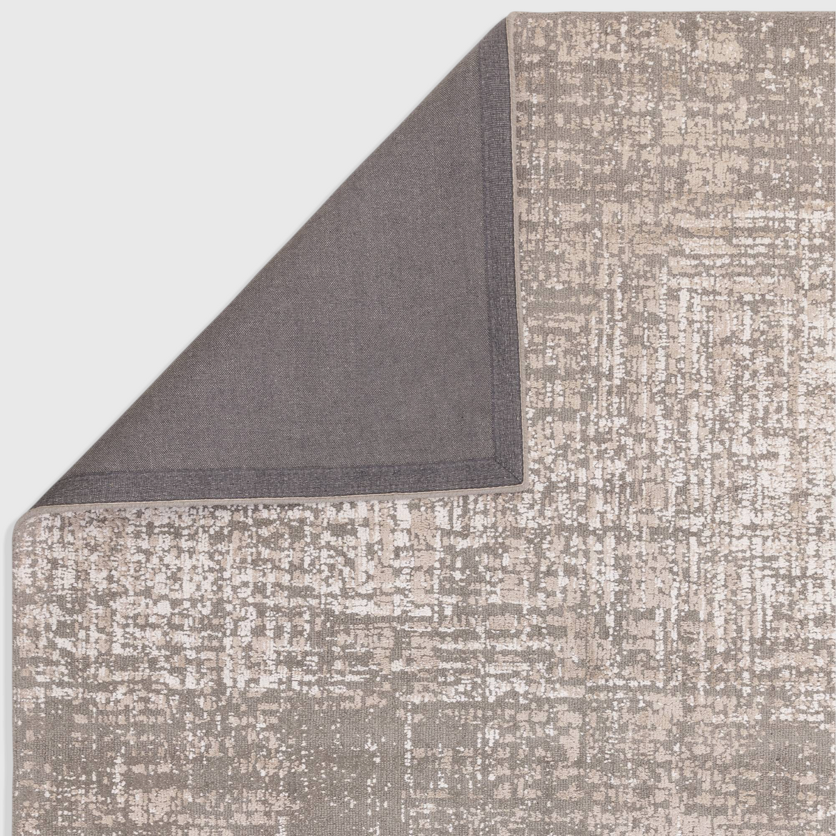 Alvo Rugs Torina natural beige abstract rug showing the textured cut and loop pile surface and dark grey backing.