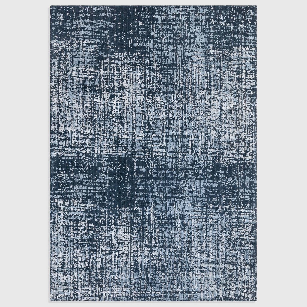 Alvo Rugs Torina petrol blue abstract area rug with a textured cut and loop pile wool and viscose finish.