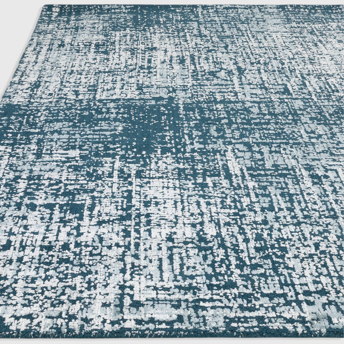 Alvo Rugs Torina teal green abstract rug with a high-low cut and loop pile texture in wool and viscose blend.