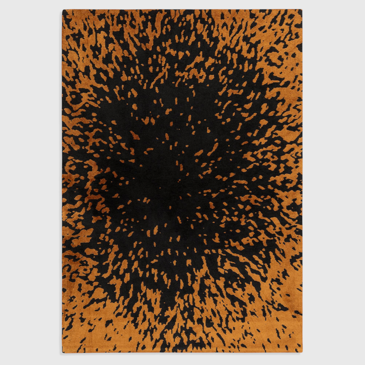 Alvo Rugs Wylder Splash charcoal and orange polyester rug with a soft cut pile animal print design.