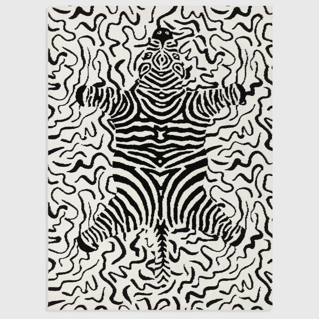 Alvo Rugs Wylder Zebra Mono rug featuring a black and white animal print pattern in soft circular-knitted polyester.