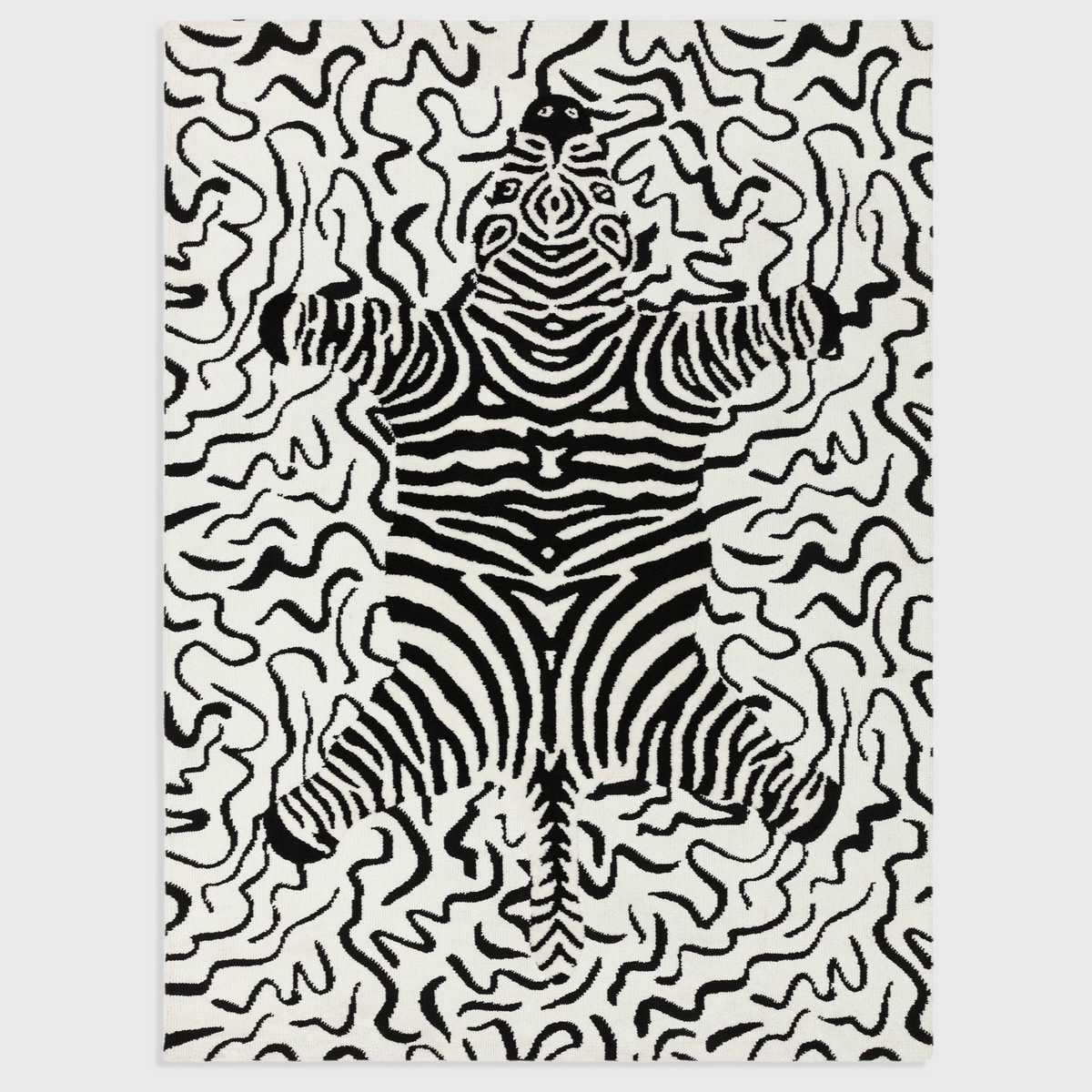 Alvo Rugs Wylder Zebra Mono rug featuring a black and white animal print pattern in soft circular-knitted polyester.